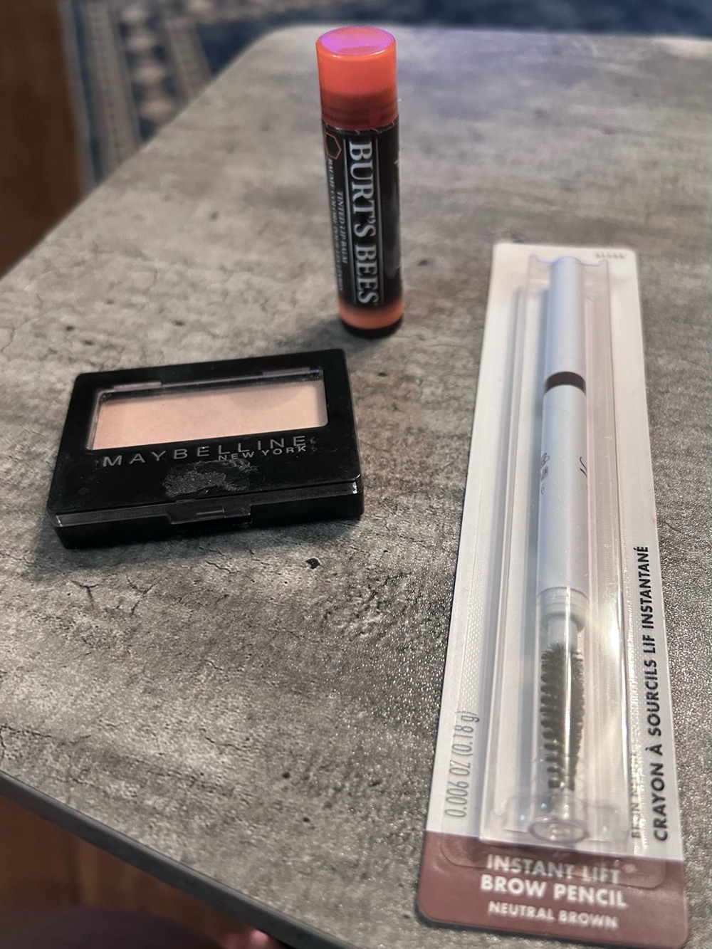 Makeup Burt Bees Lip, Maybelline eyeshadow in cream, and brown eye pencil
